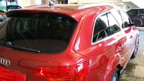 close up rear view of Audi Q7 luxury suv tinted with darkest legal film