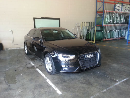 front view black colour Audi A4 sedan with ultraviolet radiation blocking car window film