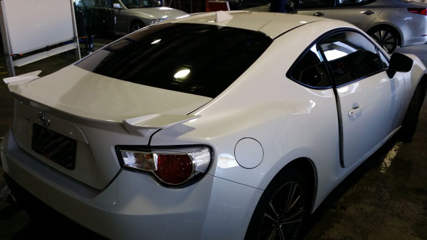 rear view white colour Toyota 86 Series sports car windows tinted