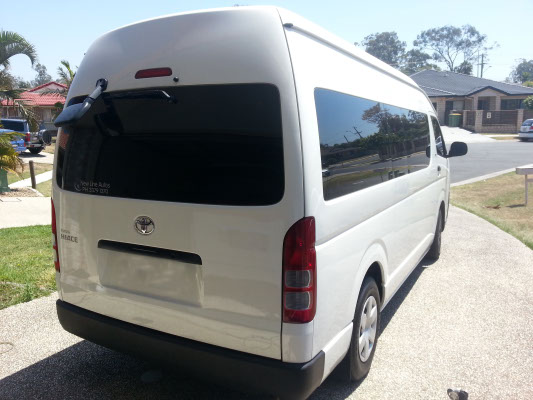 rear view white colour Toyota HiAce van rear windows tinted for commuter privacy