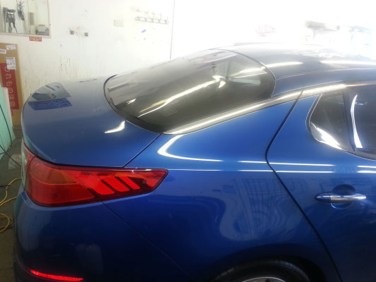 side view blue colour Kia Optima midsize sedan tinted in Brisbane by Optimus Tinting Solutions