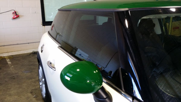 side view of Mini Cooper S driver side window tinted by Optimus Tinting Solutions