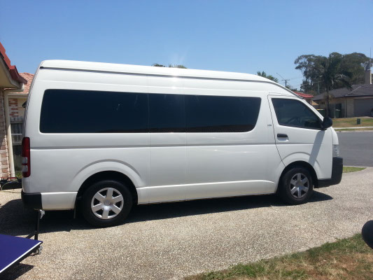 side view white colour Toyota HiAce van after tint